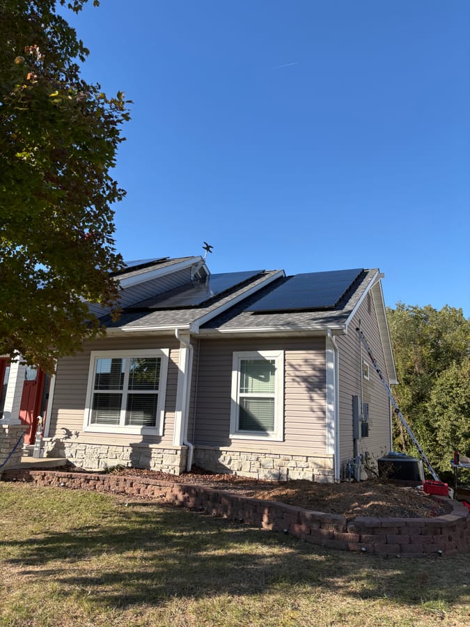 Christina's home — rooftop solar with stone landscaping